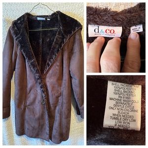 Suede like fur lined Winter coat with hood and lacing detail.